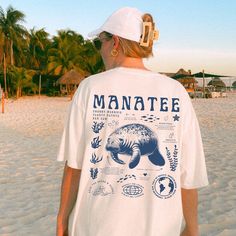 Show your love for the Manatees with our manatee-themed tee! Perfect for the manatee and nature lovers; it blends facts about these amazing creatures with a message for marine preservation. Wear it proudly and let's make waves for our adorable underwater friends!  Comfort Colors 1717 Unisex Tee : * High quality, 100% ring-spun US cotton that is ethically grown and harvested * Direct-to-garment (DTG) prints * Available in multiple size S to 4XL * The relaxed fit keeps you comfy and make it an exc Anatomy Shirts, Manatees, Beach Tee, Make Waves, Florida Beach, Marine Biology, Product Ideas, Neat Style, Nature Lovers