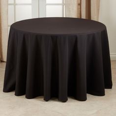 a round table with a black cloth on it