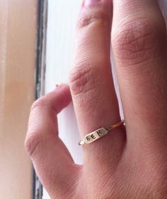 A delicate ring becomes a treasure when it's personalized with your favorite initials. Simple Yellow Gold Initial Ring For Gift, Yellow Gold Initial Ring Gift, Dainty Initial Ring Gift, Gold Simple Initial Ring As Gift, Dainty Initials Ring Gift, Ring Initials, Tiny Rings, Monogram Ring, Personalized Ring