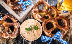 some pretzels and dip are on the table