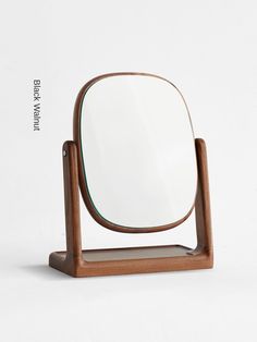 a wooden stand with a mirror on it