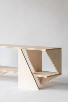 a wooden shelf sitting on top of a white floor