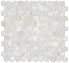 a white marble mosaic tile with hexagonal shapes