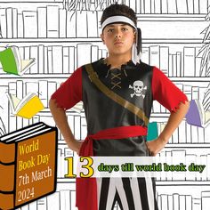 a young boy wearing pirate costume standing in front of bookshelves with the words world book day on it