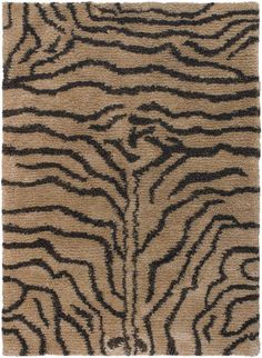 an animal print rug with black and brown stripes