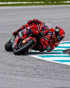 a person riding a motorcycle on a race track