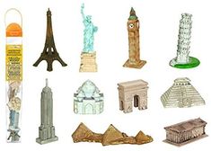 there are many miniature buildings and statues in this photo set, including the eiffel tower