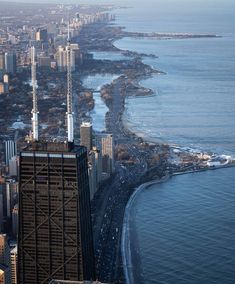 an aerial view of the chicago skyline and lake michigan