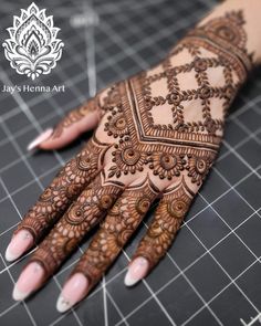 the hands are decorated with henna art