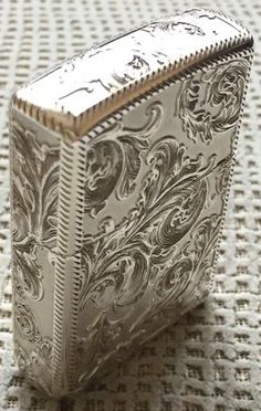 a silver box sitting on top of a table