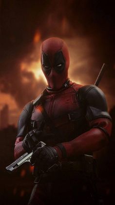 a deadpool character holding a knife in his hands