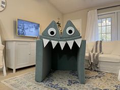 a room with a shark shaped bed in it