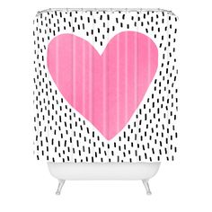 a shower curtain with a pink heart on it