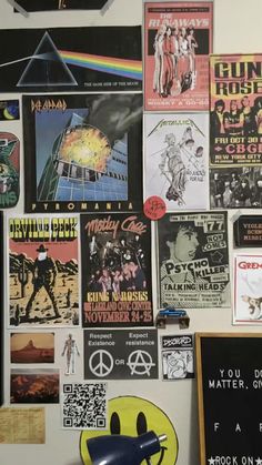 a wall covered in posters and other items