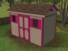 a small pink and white shed sitting in the grass