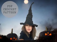 a woman wearing a witches hat with pumpkins in the background