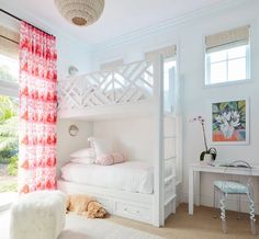 a bedroom with white furniture and pink curtains