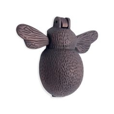 a brown ceramic figurine shaped like a bee