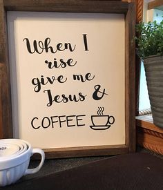 a sign that says when i rise give me jesus and coffee next to a potted plant