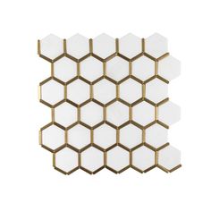 the white and gold hexagonal tiles are arranged on each other, with one side facing