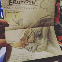 a drawing of a mouse in someone's hand with some writing on the page