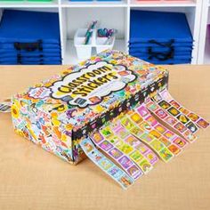 an open box sitting on top of a table in front of some bookshelves