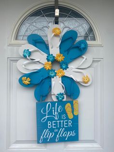 a door hanger with flip flops on it