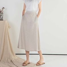 "DETAIL * 100% Linen * Back elastic * Two side pockets * A Line skirt * Below knee length skirt * Wash by hand or machine with cold water * The model is 170cm (5′ 7″) tall with a 66cm (26\") waist. She is wearing a XS/S in natural color. * Choose CUSTOM Order if you Need a better fit Can't find your size in our size Chart Change the Style Chang the Length Your Height is not Between 5'1\" - 5\"9\" SIZING AND FIT, Garment size as follow XS/S Waist 66-71cm Hips 100cm Length 75cm Weight suggest with Long Work Skirt With Side Pockets, Long Workwear Skirt With Side Pockets, Chic Long Pencil Skirt With Pockets, Summer Bottoms With Pockets, Midi Length, Solid Color Midi Skirt For Summer, Knee-length Elastic Waistband Skirt For Work, Casual Spring Pencil Skirt With Pockets, Summer Solid Color Midi Skirt, Workwear Midi Skirt With Elastic Waistband