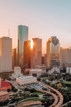 an aerial view of the city skyline at sunset