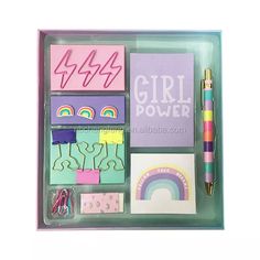 an assortment of stationery items in a plastic box with the words girl power written on it