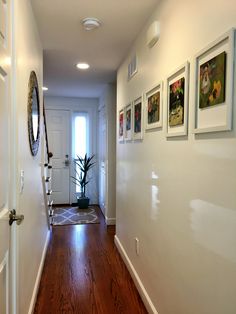 the hallway is clean and ready to be used as a place for pictures or photos