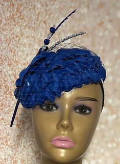 Royal Blue Flower Fascinator Half Hat for Church head covering, Tea Party, Wedding, and other Special Occasions  Accented with blue veil netting, rhinestone hat pin, feather and faux pearl. The hat pin may vary and is for decorative purposes only. The hat is affixed to the head via a hat string. Available in 2 sizes: 8 X 5.5 inches  10 X 7 inches Mannequin is wearing the 8 by 5.5 inches. Handmade Gifts for mom, sister, wife, or yourself. SHIPPING  All items for free shipping will be shipped via Blue Mini Hats With Handmade Flowers For Royal Ascot, Blue Summer Wedding Costume Hats And Headpieces, Blue Costume Hats And Headpieces For Summer Wedding, Summer Blue Headpiece With Handmade Flowers, Spring Blue Mini Hats With Handmade Flowers, Blue Fascinator With Handmade Flowers For Kentucky Derby, Blue Handmade Flowers Fascinator For Races, Blue Mini Hat Headband For Spring, Blue Headpieces For Spring Party