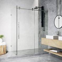 a bathroom with a sink, mirror and shower stall in the middle of the room