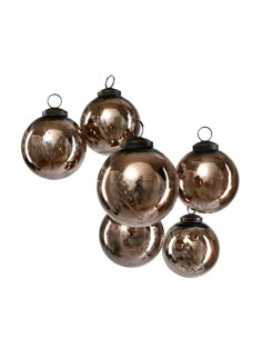 six shiny glass ornaments hanging from the ceiling