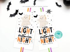 two halloween bookmarks with bats on them and the words, light the halloween night