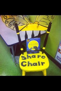 a yellow chair with a book sitting on top of it