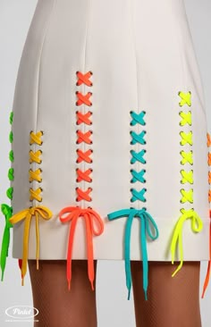 the skirt is decorated with multicolored laces