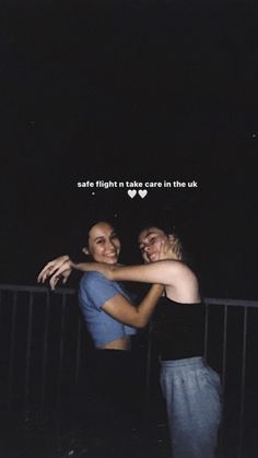 two women hugging each other in front of a dark background with the words safe flight take care in the uk