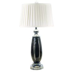 a black and white table lamp with a white shade on the top, against a white background