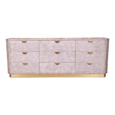 a white dresser with gold handles and drawers on the bottom, against a white background