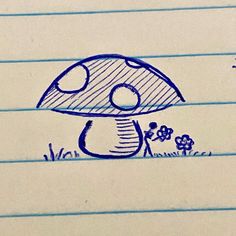 a drawing of a mushroom sitting on top of a piece of paper with writing underneath it