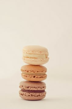 three macaroons stacked on top of each other in front of a white background