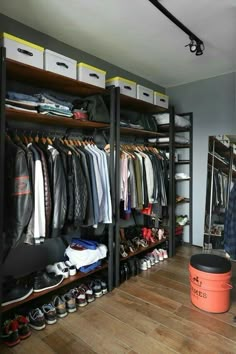 the closet is full of clothes, shoes and other items for men's wardrobes