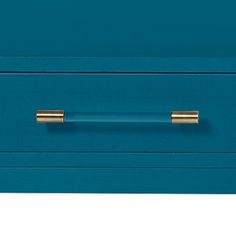 a blue drawer with two brass handles