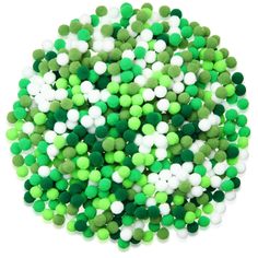 green and white pom - poms are arranged in a circle on a white background