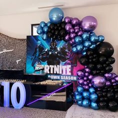 balloons and decorations are displayed in front of a sign for the 10th birthday party at fortte town season