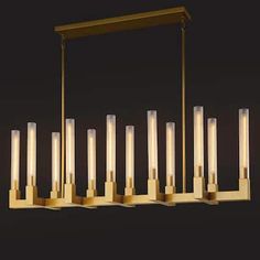 a large rectangular chandelier with eight candles hanging from it's center beam