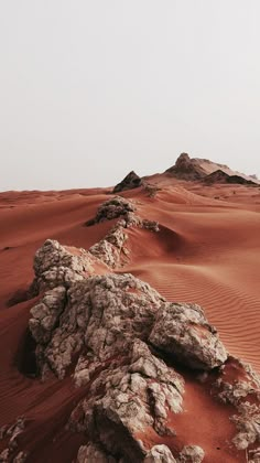 rocks and sand in the middle of a desert