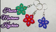 two flower keychains made from crochet are shown in three different colors