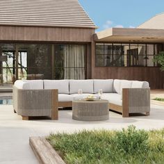 an outdoor living area with furniture and a pool in the background